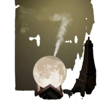 Wood coloured spherical Lunar humidifier night light on a bedside table emitting mist and soft white light.