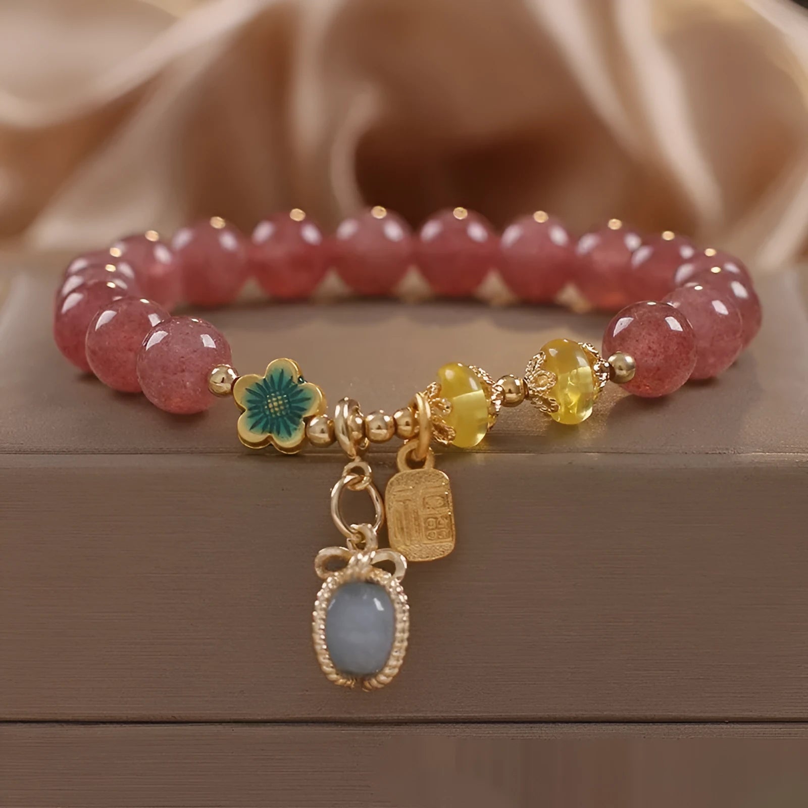 Red strawberry quartz beaded bracelet with alloy metal accents and rhinestone decorative details for women