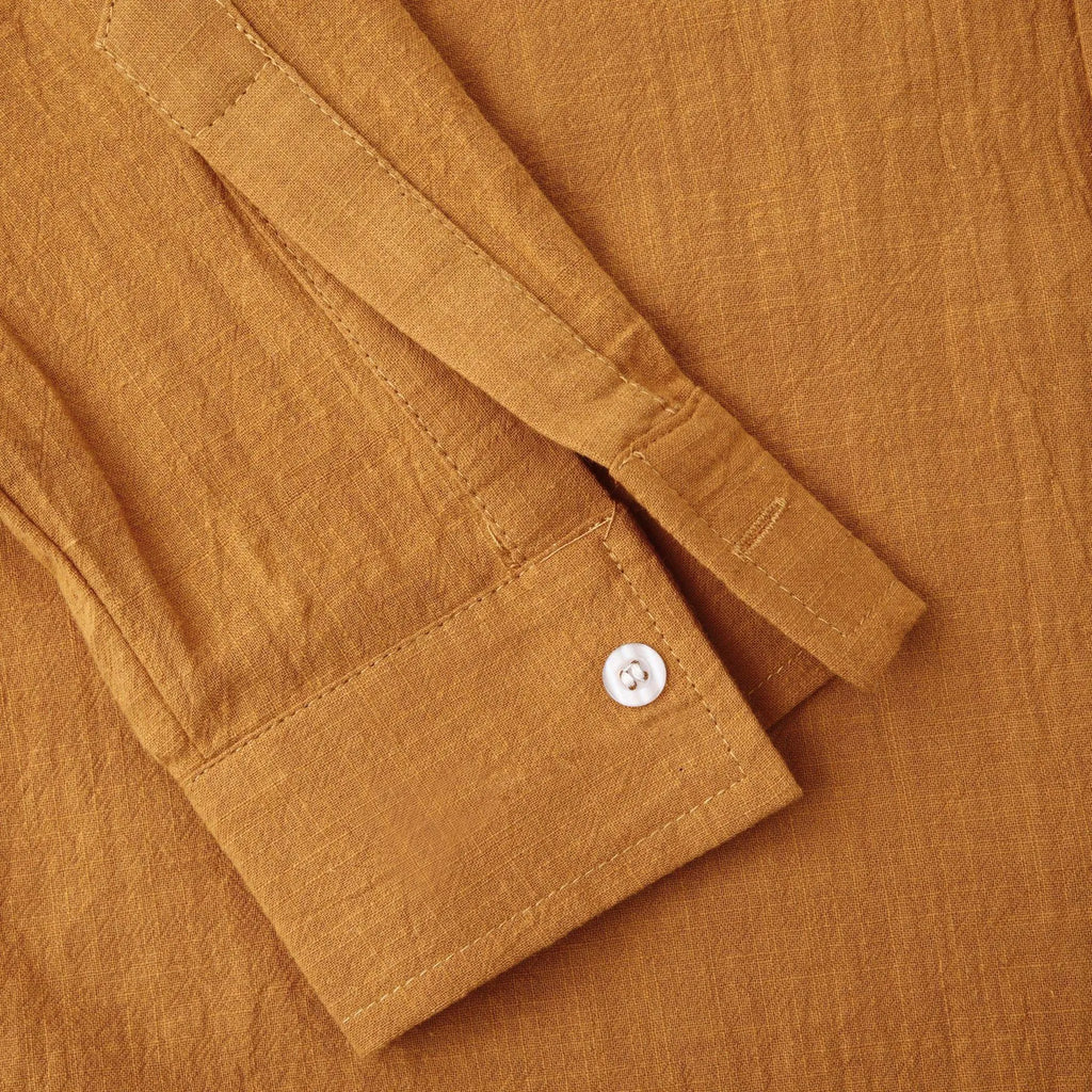 Men's brown long sleeve cotton blend shirt and casual trousers set on a hanger