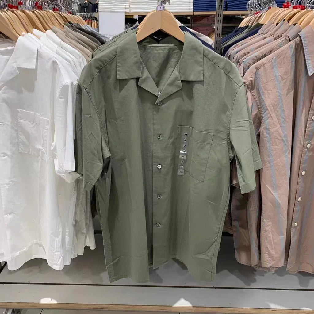 Man wearing a beige modal cotton open collar cardigan-style casual shirt.