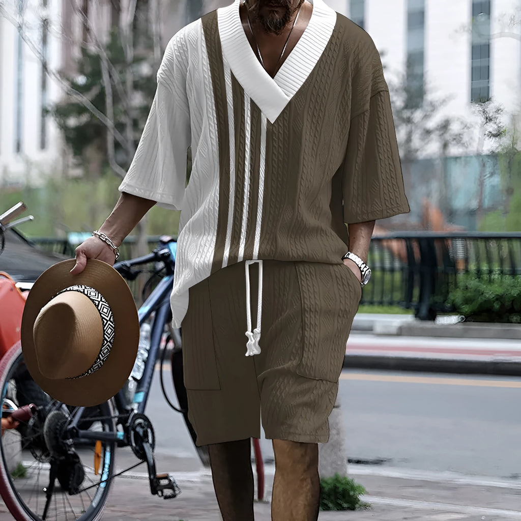 Men's printed drop-shoulder knitted short-sleeved top and matching shorts suit in a polyester blend fabric.