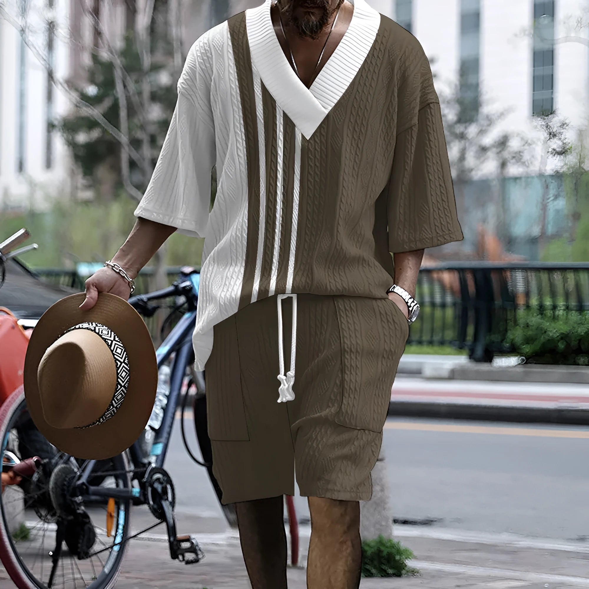 Men's printed drop-shoulder knitted short-sleeved top and matching shorts suit in a polyester blend fabric.