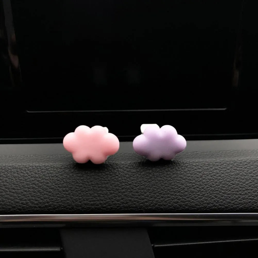 Resin Baiyun cartoon car fragrance clip in multiple colours attached to vehicle air vent measuring 17mm x 27mm