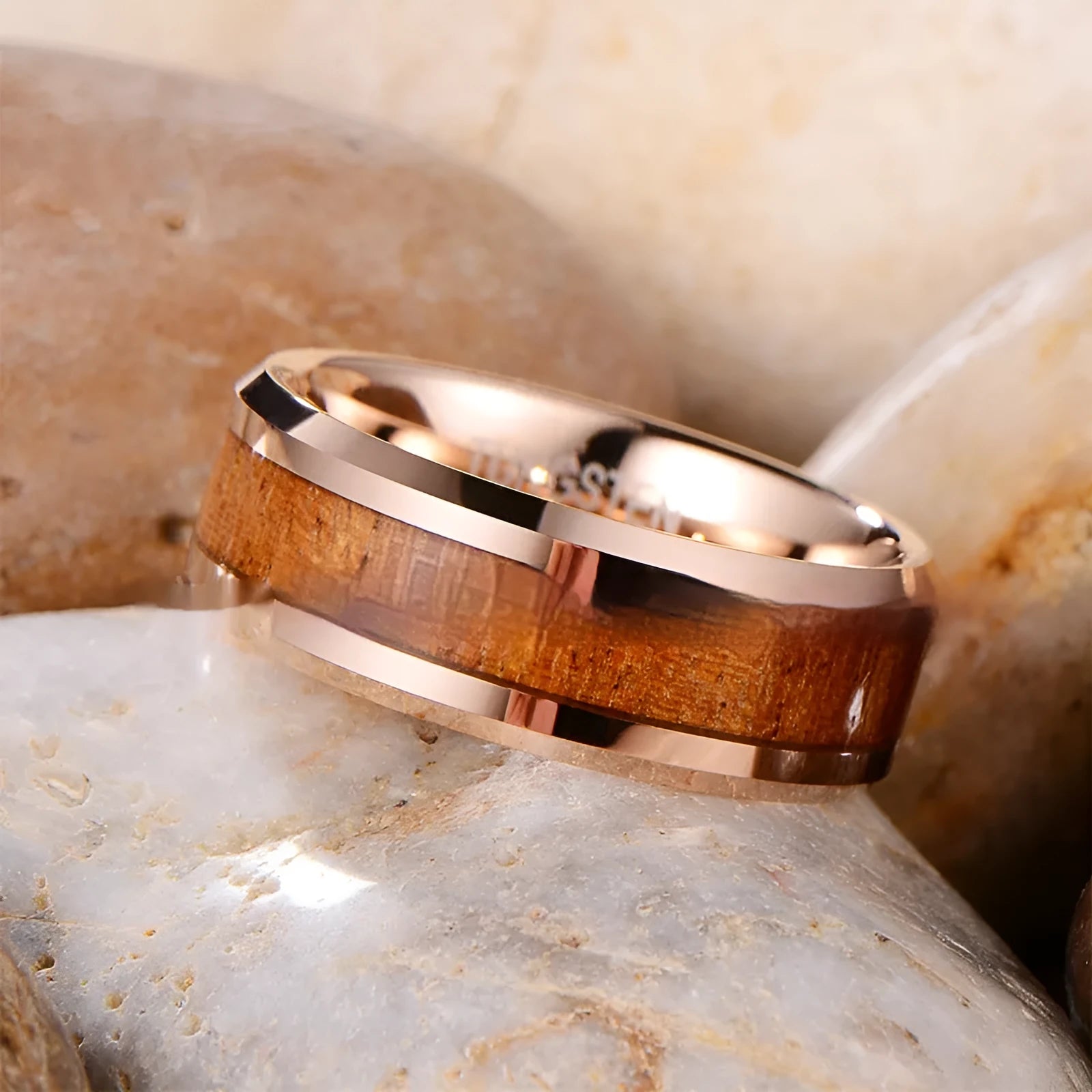 Men's wide 8mm tungsten wedding ring with a leather inlay, shown in rose gold and steel colour finishes.