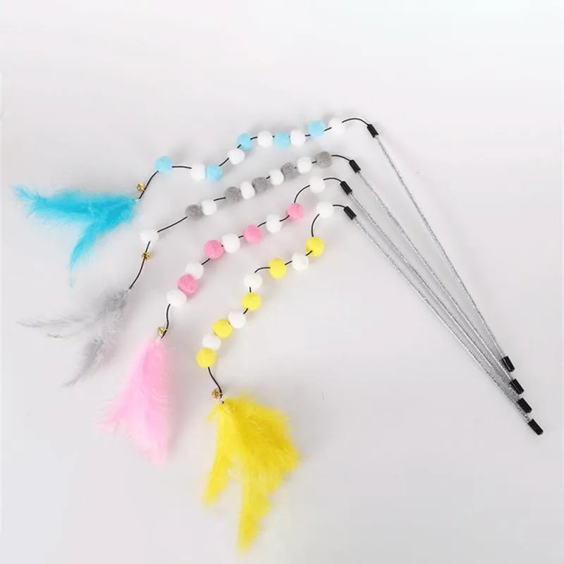 Colourful cat teaser toy rod with bell and pompon feather attachment on grey background