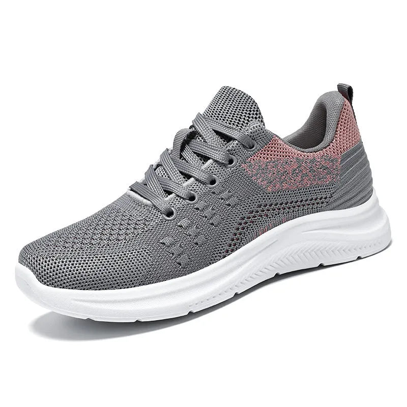 Women's black mesh sneakers with round toe and lace-up front on soft PVC sole