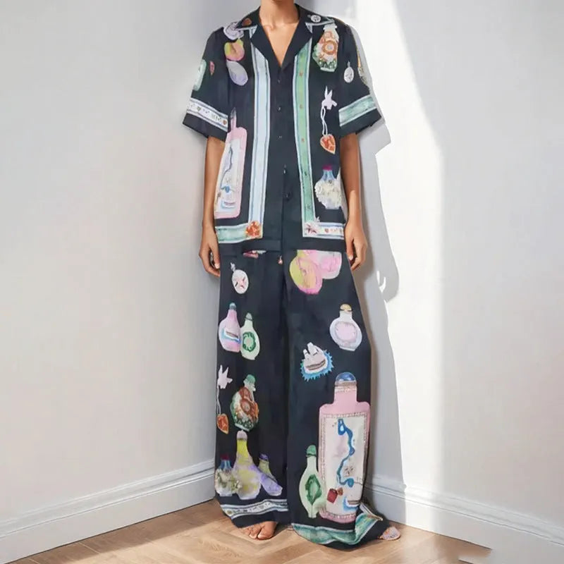 Black women's cardigan and pants set with cartoon animation print.
