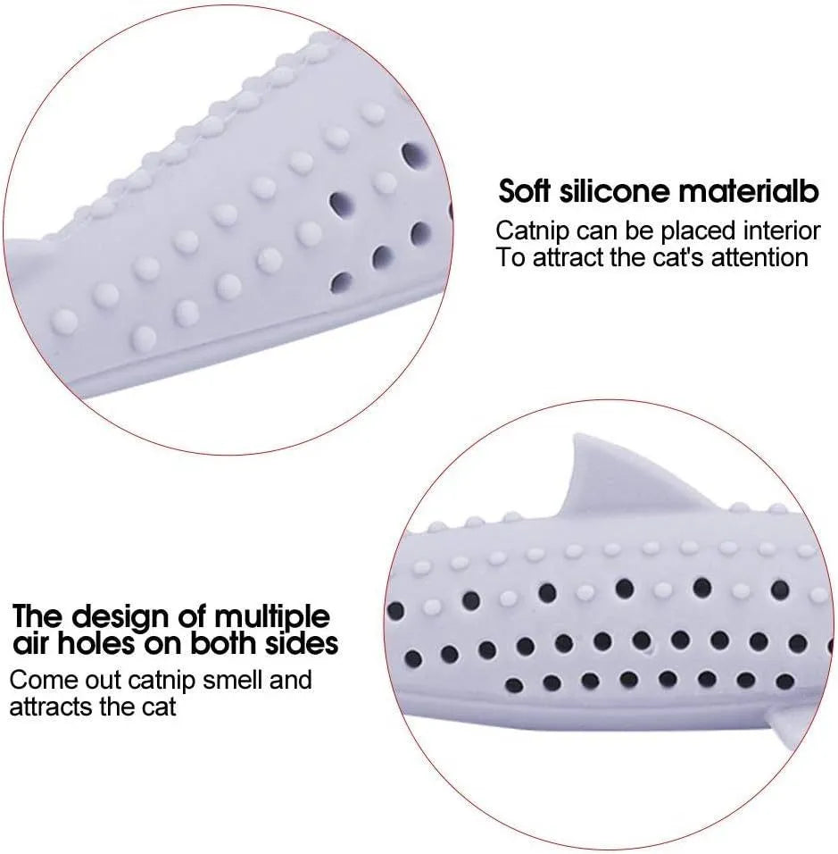 Green silicone dolphin-shaped cat chew toy on a white background, showing side air holes.