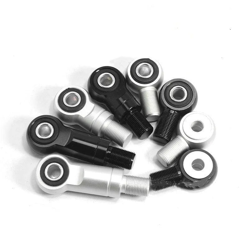 CNC aluminium motorcycle shock fork head riser in black and silver, showing 2CM and 4CM lift options.