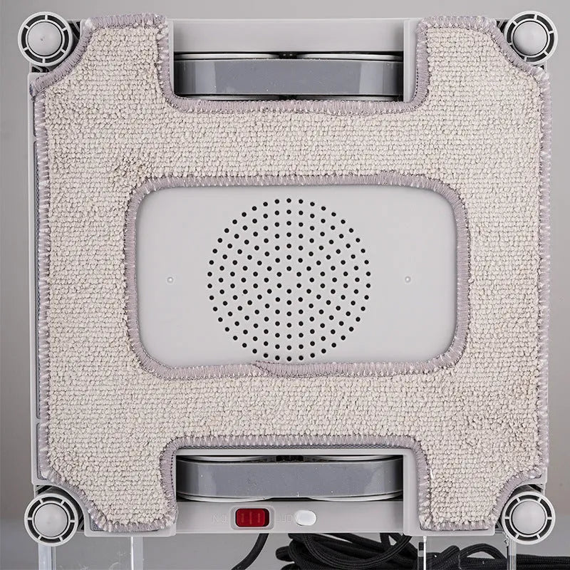 White intelligent window cleaning robot with water spray nozzles for high-rise buildings