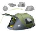 Dark green automatic pop up camping tent pitched outdoors showing waterproof rainfly and compact 2 person size