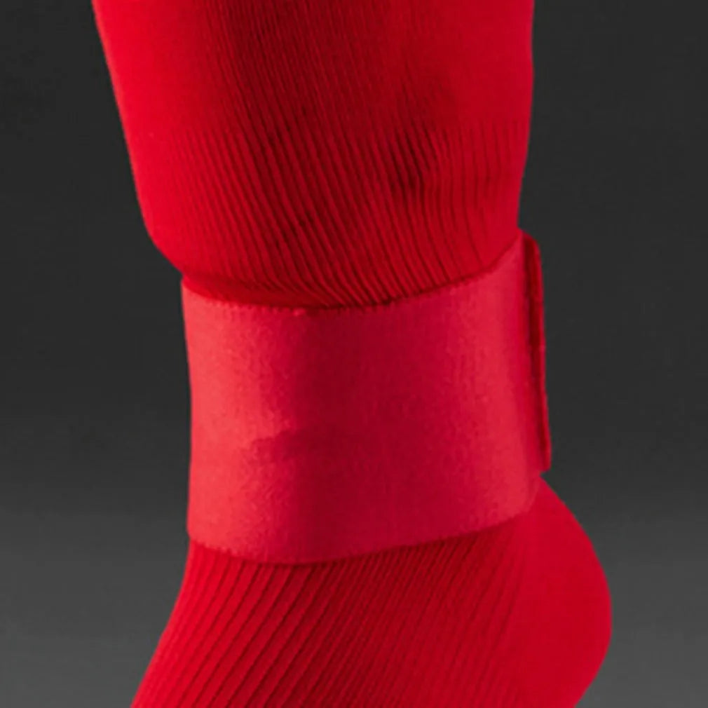 Red rubber football shin guard magic tape belt showing elastic strap for sports protection