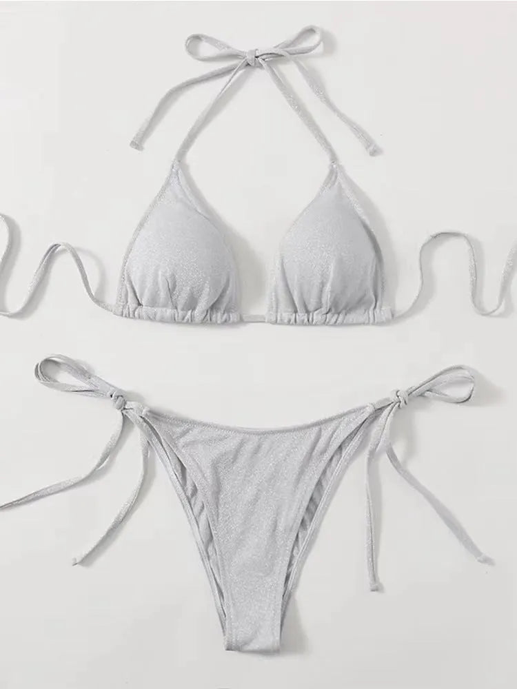 Women's bandage-style bikini swimsuit in polyester available in six colours with detailed size chart