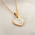 Gold plated heart pendant necklace with white shell centre and personalised letter engraving on adjustable chain