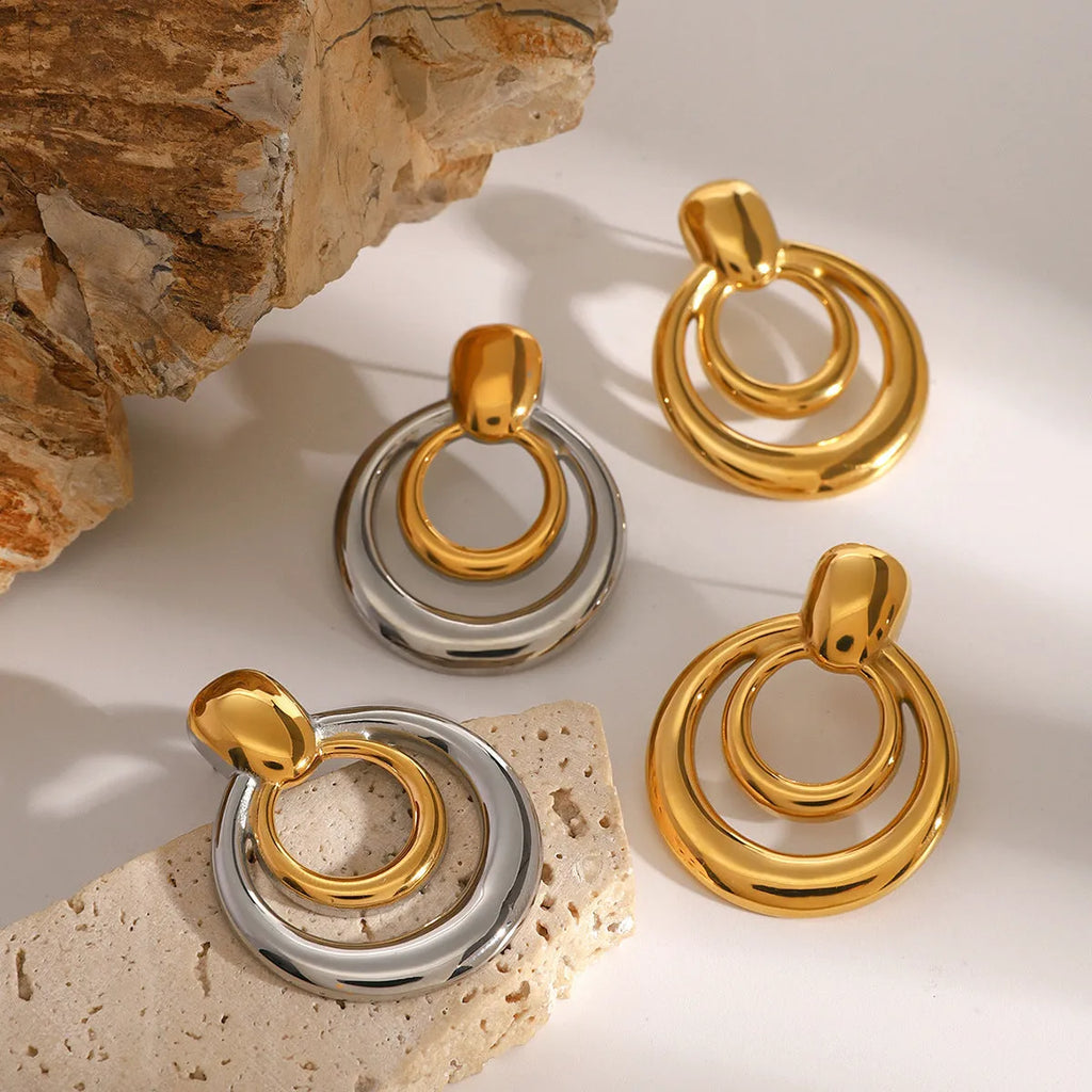 Golden round geometric double-layer hollow stud earrings with 18K gold electroplating on titanium steel