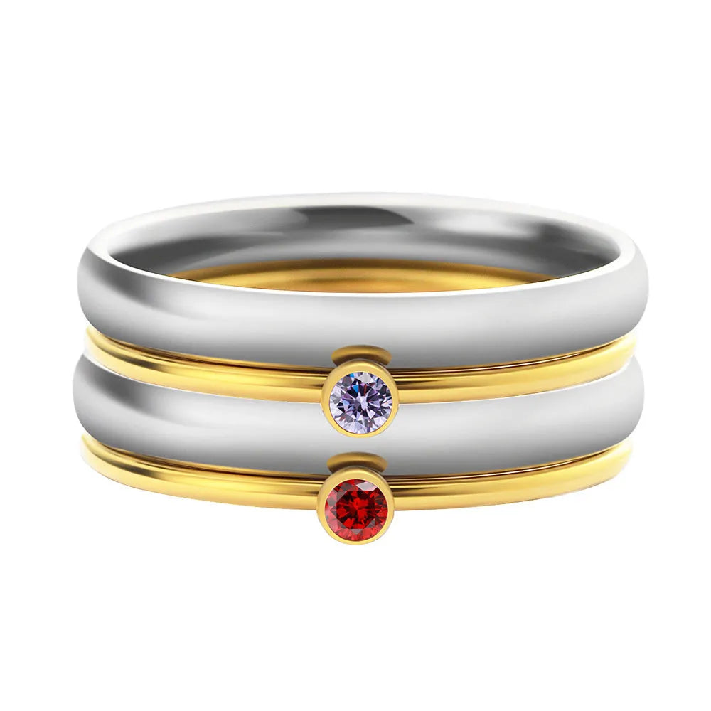A geometric engraved titanium steel ring featuring a December birthstone colour.