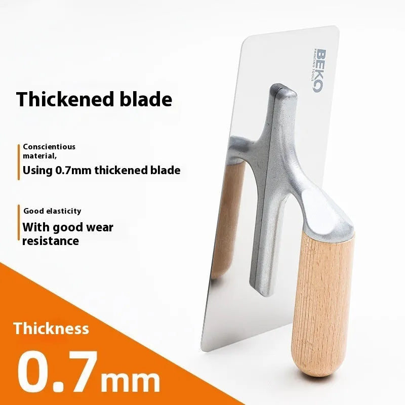 Stainless steel scraper tool with wooden handle for floor and wall putty removal.