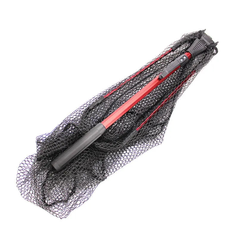 Red aluminium alloy triangular folding dip net collapsed to 47cm length on grass