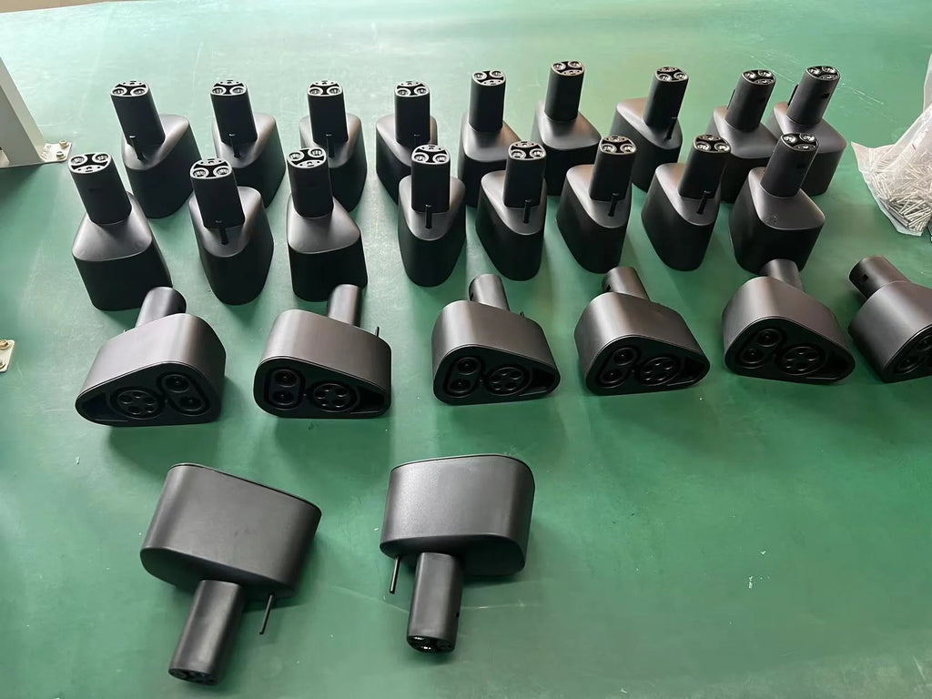 Black Tesla charging plug converter adapter for American standard EV charging points.