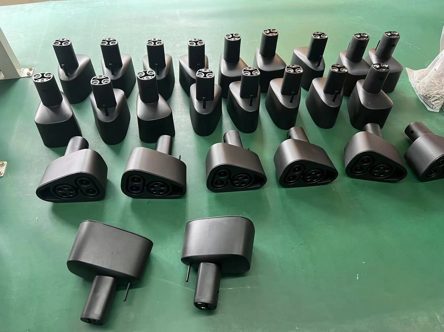 Black Tesla charging plug converter adapter for American standard EV charging points.
