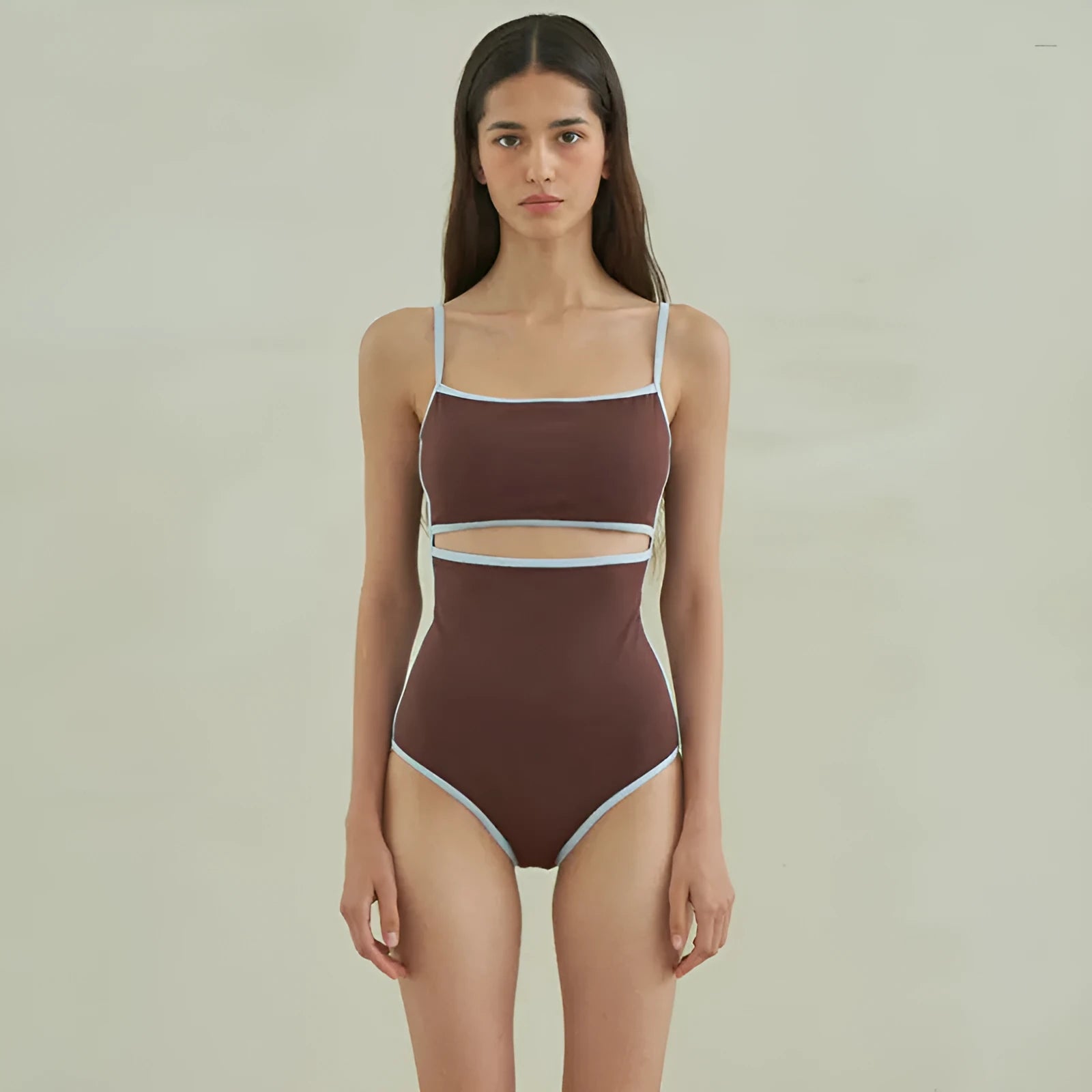 Brown women's triangle one-piece swimsuit made from nylon fabric.