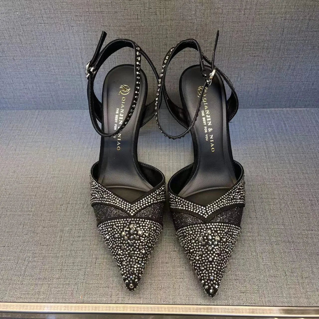 Women's silver and black hollow high heels with red sole and pointed stiletto heel