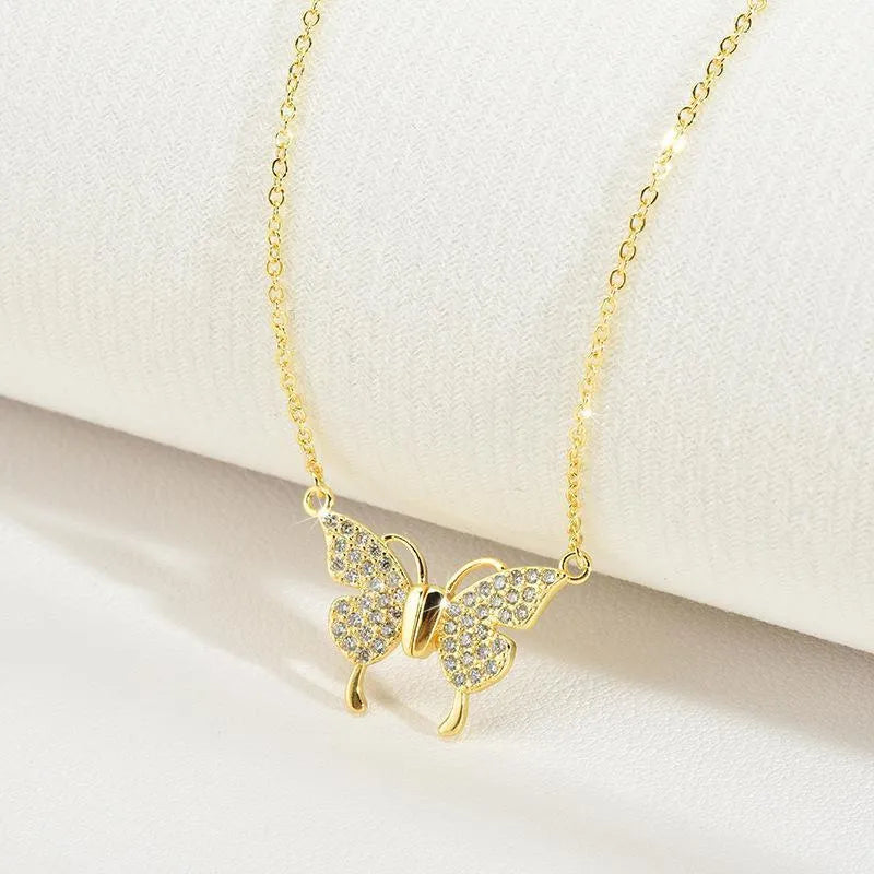 Gold and silver titanium steel twisted chain necklace with magnetic butterfly clasp.