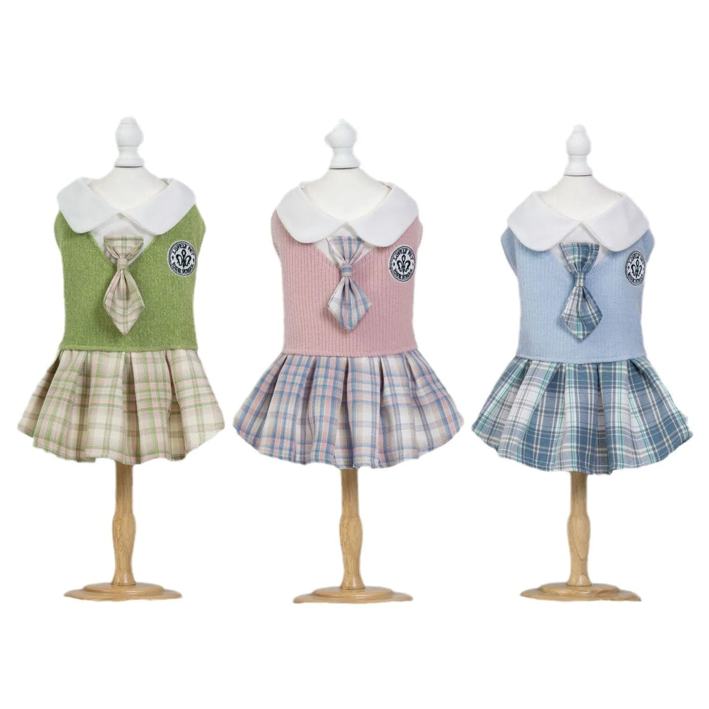 Blue tartan plaid skirt for a small dog standing on grass.
