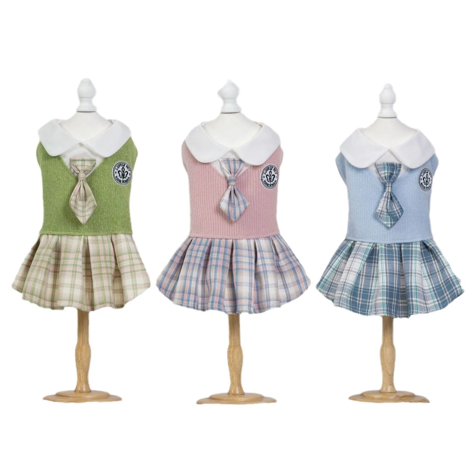 Blue tartan plaid skirt for a small dog standing on grass.