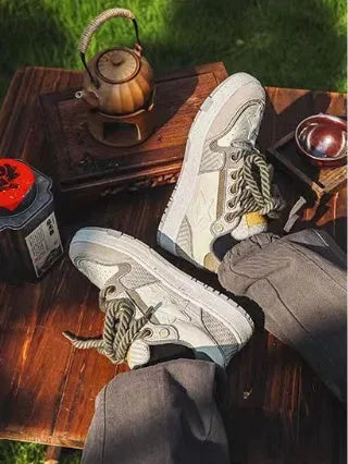Green low-top canvas casual shoes with star pattern and white stitching on a rubber sole.