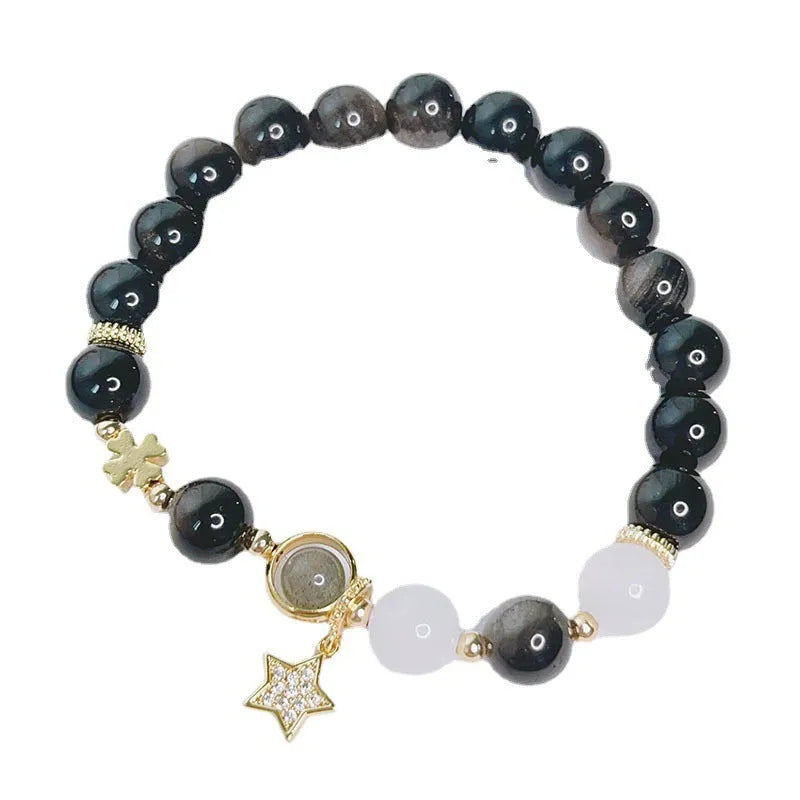 Silver stone bracelet with electroplated finish showing floral, love heart, and star charm designs