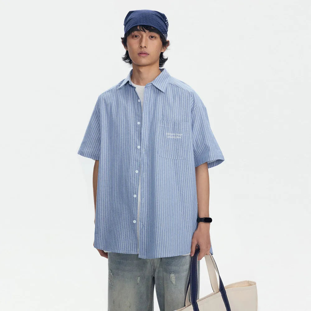 Blue striped loose fit overalls shirt with short sleeves on hanger