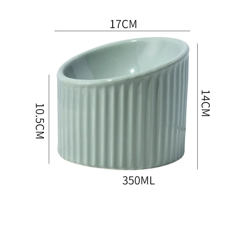 Ceramic elevated cat bowl in green or yellow with a tilted, round, whisker-friendly design.