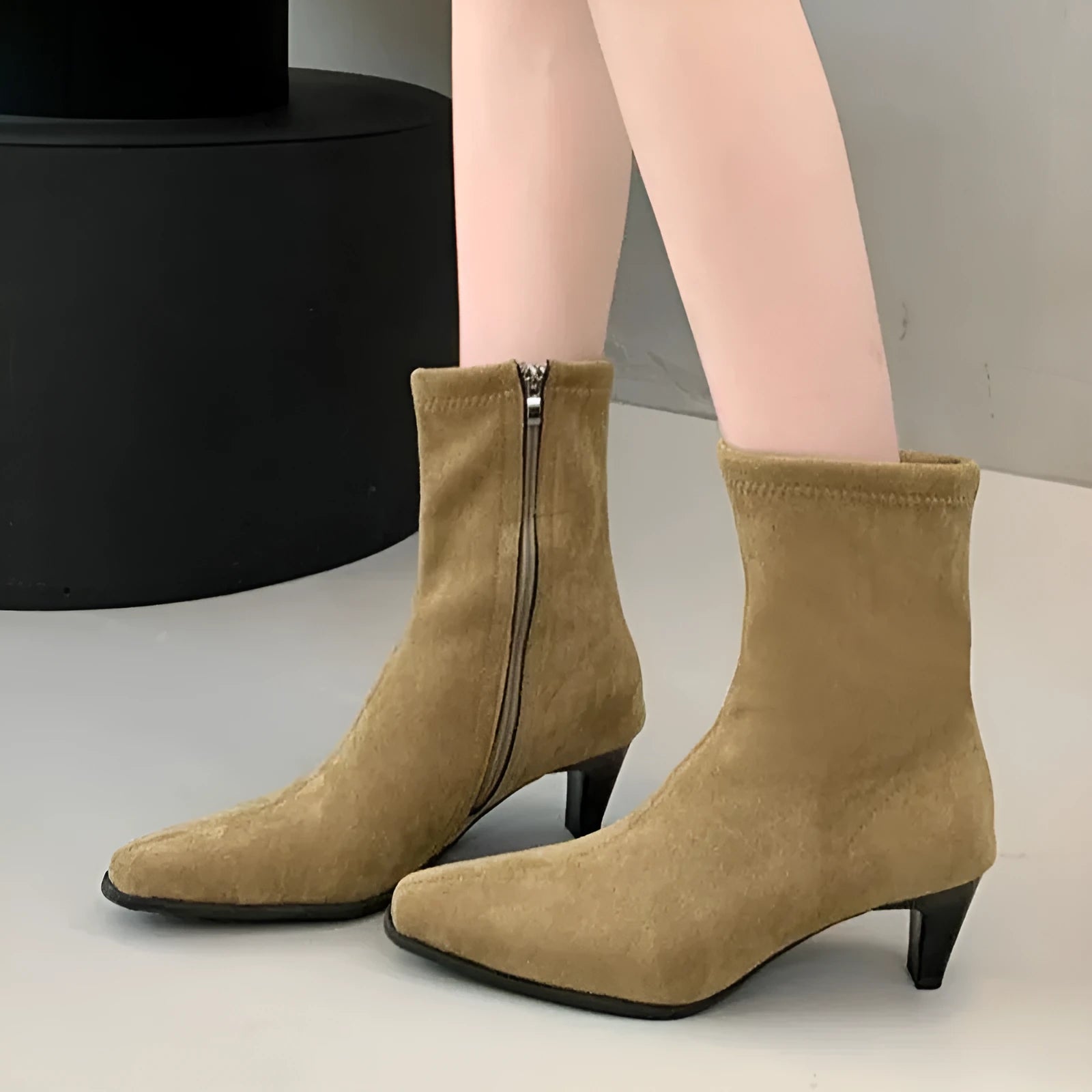 Brown square toe women's ankle boots with a side zipper, kitten heel, and a waterproof platform sole.