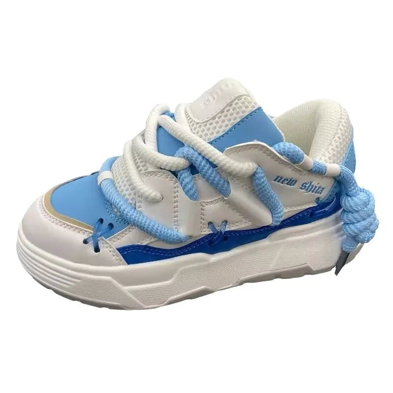 Women's grey retro clunky sneakers with a thick rubber sole and front lace-up closure on a white background.