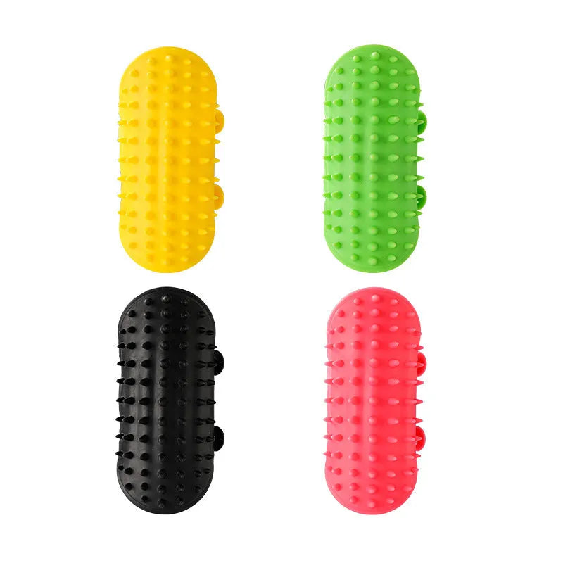 Silicone cat grooming massage comb with rounded teeth and adjustable mounting strap in assorted colours