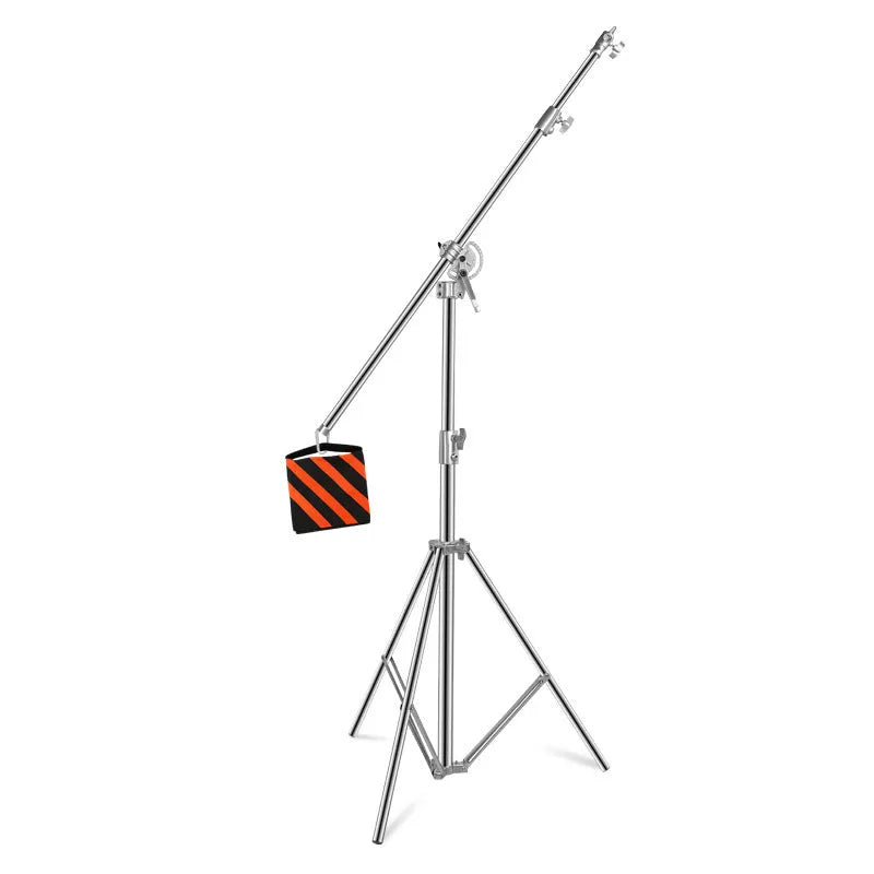 Silver stainless steel ceiling-mounted cross arm lamp rack showing extended and collapsed positions