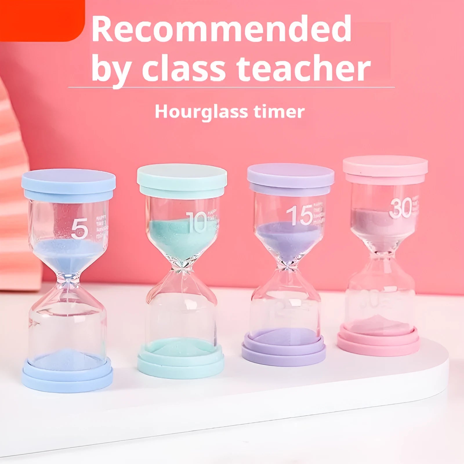 Handmade glass sand clock timer on a desk, showing purple sand flowing, with blue, green, and pink variants beside it.