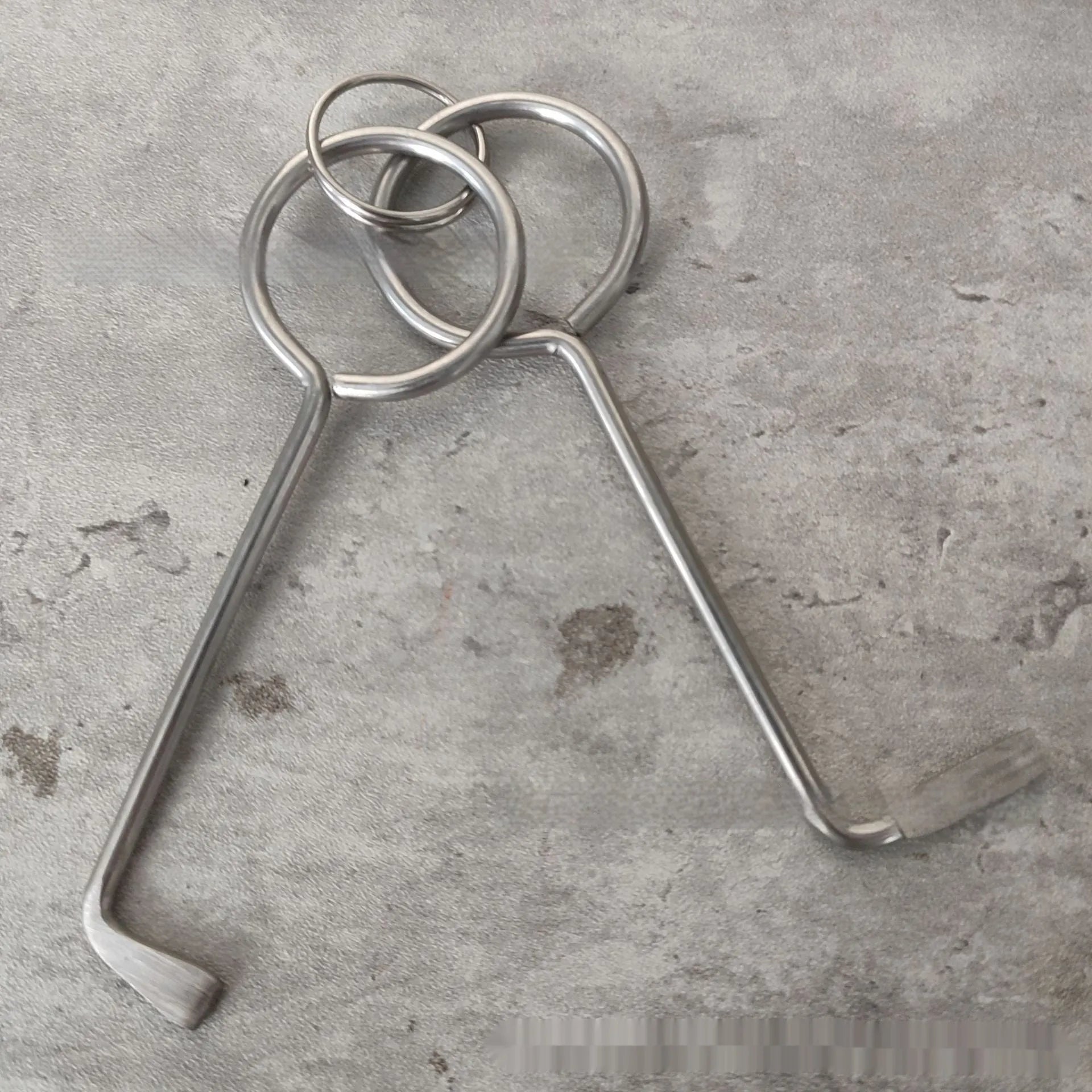 Two alloy metal wrench tools from a portable universal set for DIY and repairs.