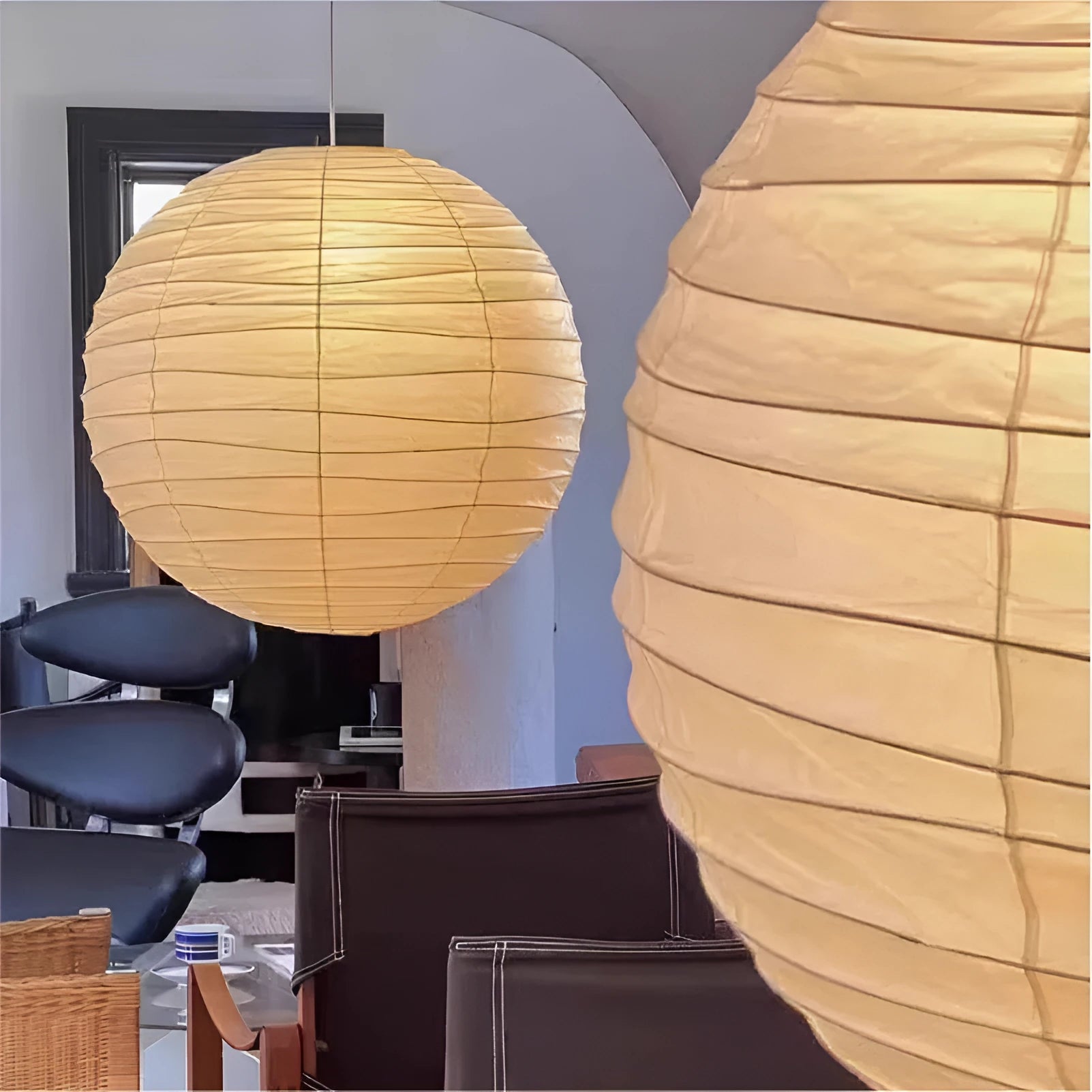 Japanese style spherical rice paper ball chandelier pendant light with warm glow.