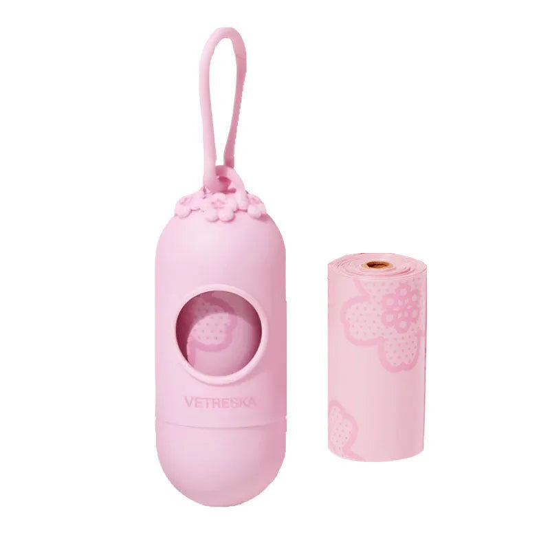 Portable dog waste bag dispenser capsule with scented inner bags in strawberry, orange, and cherry blossom options