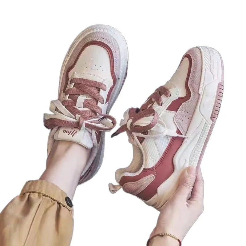 Low top sneakers with rubber sole in pink, milky white, and beige colours