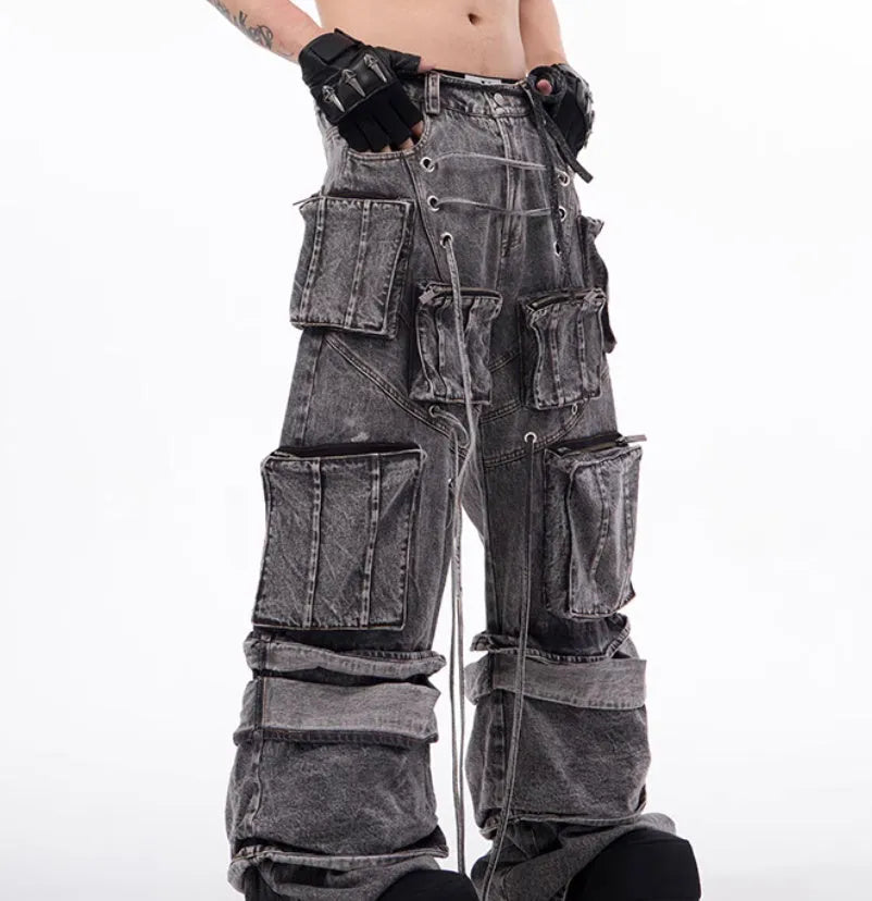 Grey distressed denim men's overalls with rope stitching detail on the front