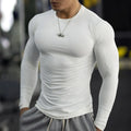 Men's black slim-fit long sleeve fitness tights made from quick-dry fabric for exercise.