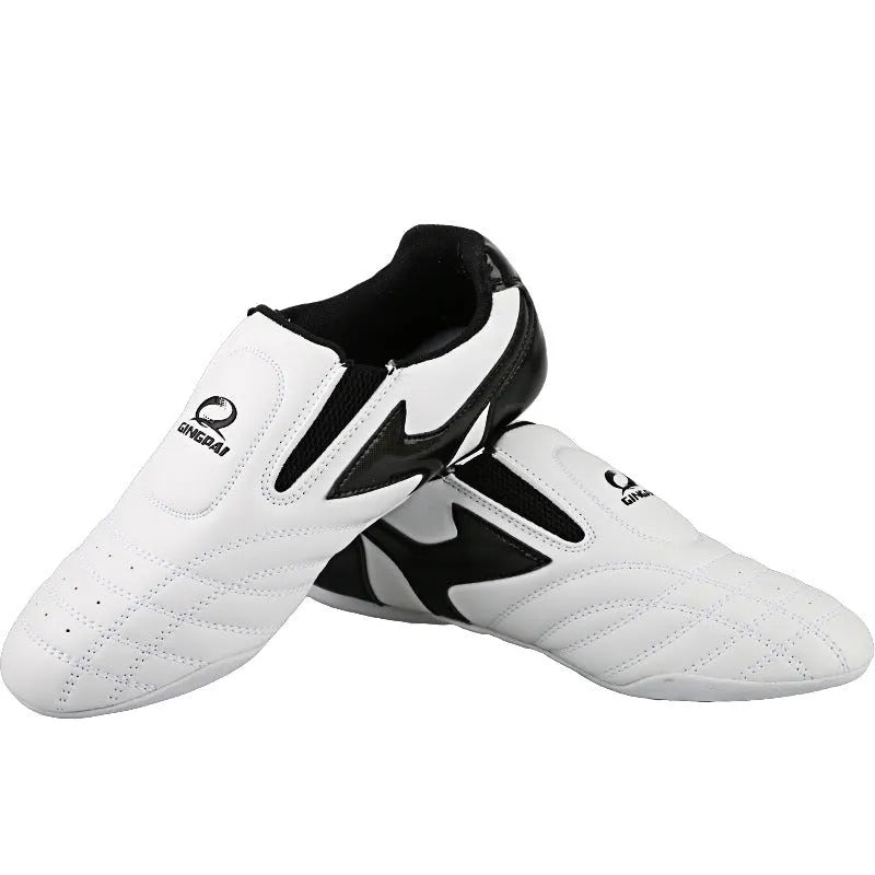 Black and white children's martial arts shoes with soft sole and widened fit for boxing training