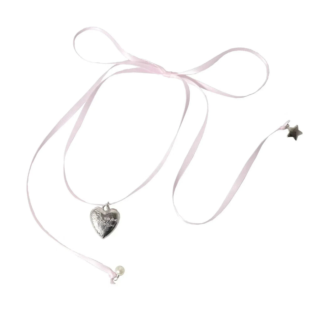 Women's alloy fashion necklace with ribbon design and a love pendant on a clavicle chain.