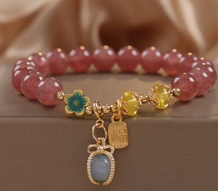 Red strawberry quartz beaded bracelet with alloy metal accents and rhinestone decorative details for women