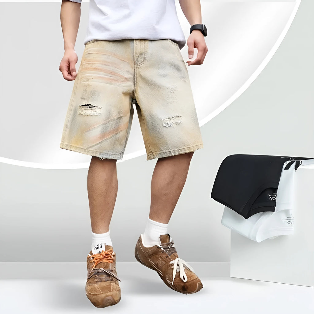 Men's light blue washed denim shorts with ripped details and a straight-leg cut