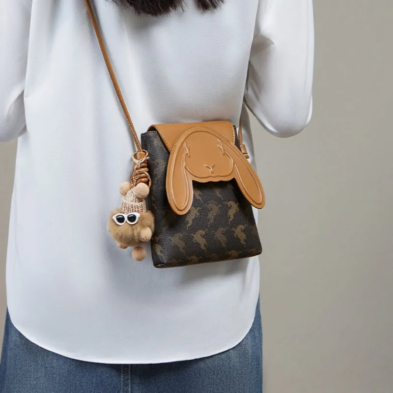 coffee colour crossbody phone bag with pom-pom pendant PU material vertical square shape open pockets