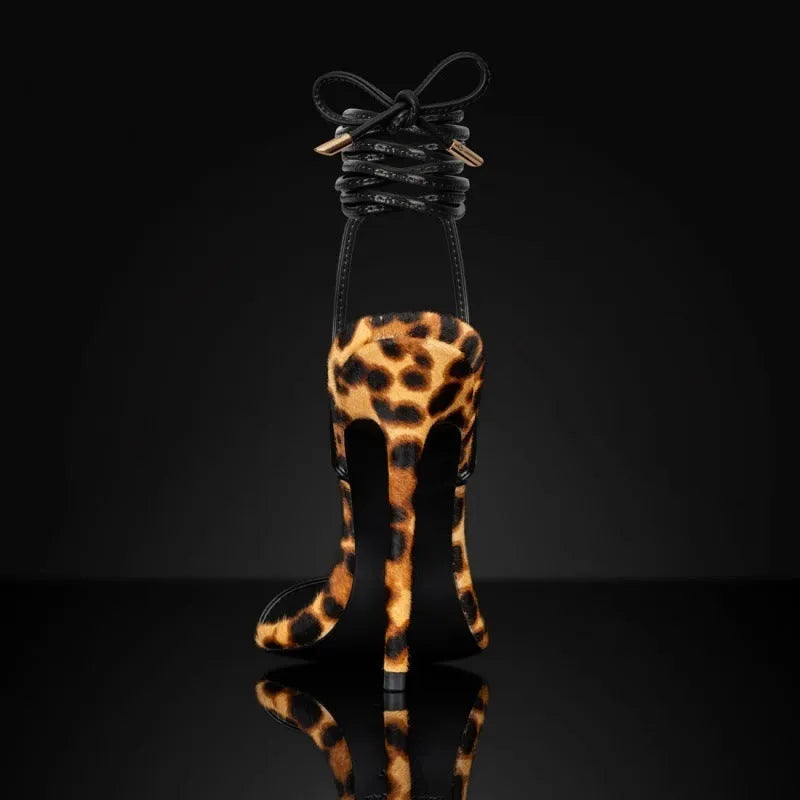Women's leopard print Roman gladiator sandals with lace-up straps and a pointed toe.